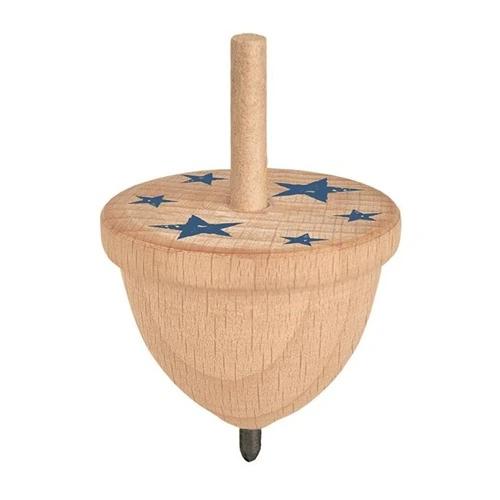 Een draaiende PhänoMINT houten tol op een witte ondergrond, die door het snelle draaien visuele patronen creëert